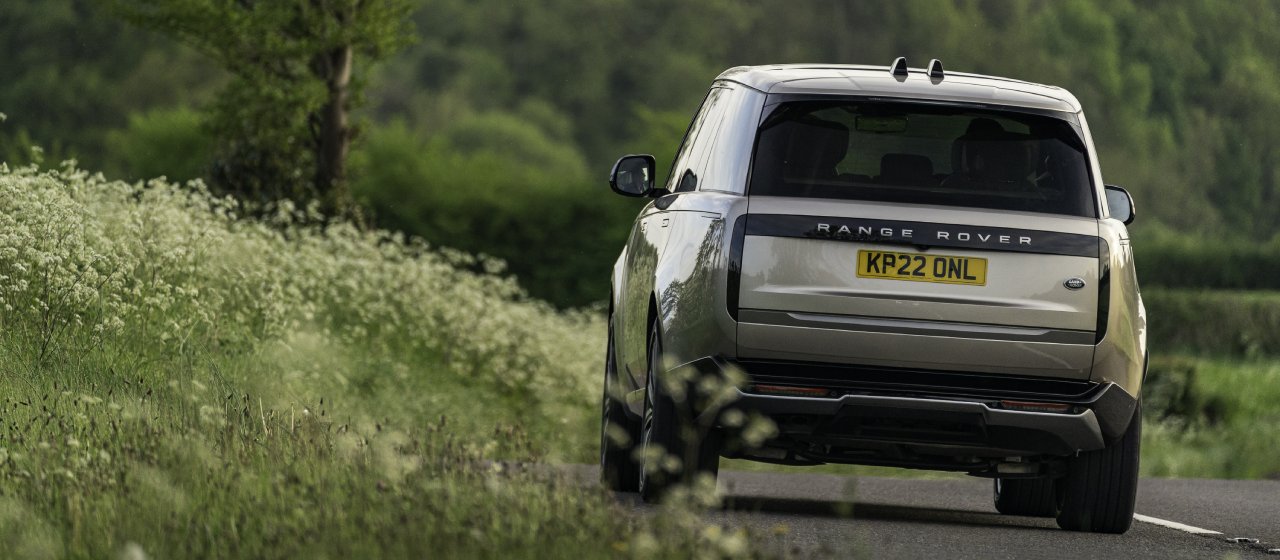 Eiger Grey Range Rover driving through scenery